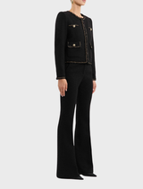 A black Stargazing Jacket hanging, highlighting its modern style and material.