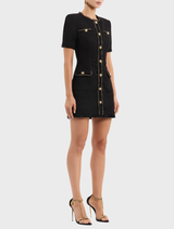 Elegant black mini dress ideal for stargazing, showcasing a sleek design and subtle celestial motifs.