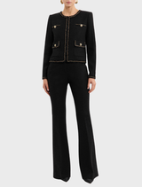 Black Stargazing Jacket displayed on a hanger, showcasing its sleek design and fabric texture.