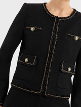 A black Stargazing Jacket presented on a hanger, illustrating its stylish appearance and fabric.
