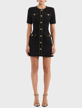 Black mini dress designed for stargazing, featuring a fitted silhouette and delicate star-patterned accents.