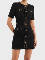 Chic black mini dress tailored for stargazing, highlighting a form-fitting style with decorative star details.