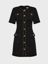 Fashionable black mini dress suitable for stargazing, featuring a modern cut and intricate star embellishments.