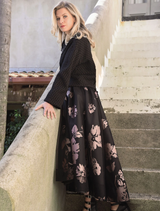 Black and pink skirt featuring a bow detail, showcasing a stylish and playful design suitable for various occasions.
