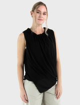 Black Stine top displayed, illustrating its chic design and high-quality fabric.