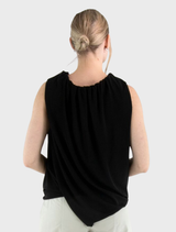 Stylish black Stine top showcased on a hanger, featuring a minimalist design and soft texture.