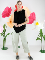 Elegant black Stine top hanging, highlighting its modern style and smooth material.