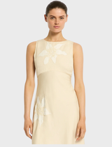 Trendy Nikita short dress in a soft straw tone, perfect for daytime wear or evening gatherings.