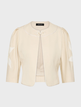 Elegant Nikita Jacket in straw hue, designed for versatility and comfort in various settings.
