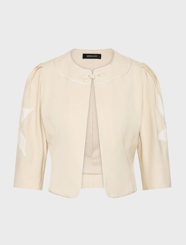 Elegant Nikita Jacket in straw hue, designed for versatility and comfort in various settings.