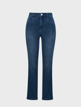 A woman showcases a stylish outfit featuring slim fit stretch jeans paired with a casual shirt.