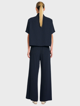 Minimalist navy and chalk striped crop shirt featuring a classic collar and button front, crafted from Flex Weave fabric.