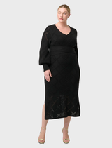 Black V-neck dress in a viscose cotton blend, showcasing a chic and versatile design suitable for various events.