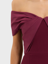 Stylish wine off-the-shoulder gown, featuring a fitted design and elegant drape, ideal for formal gatherings.