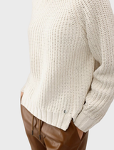 Textured almond chenille sweater displayed, illustrating its warmth and inviting style for cooler weather.