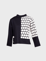 Hexagonal jacquard knit fabric in ecru and black, showcasing a geometric pattern with contrasting colors.