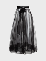 Black skirt with pink highlights and a decorative bow, offering a trendy and fashionable look.