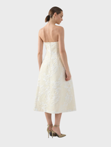 Stylish Madelein dress in champagne color, offering a chic and elegant look for any formal setting.
