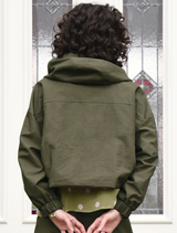 Khaki off-duty jacket laid out, emphasizing its comfortable fabric and stylish cut for informal settings.