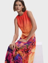 A dress with a lively orange and blue print, designed for a chic and trendy appearance.