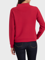 Stylish chimney red top with a stand-up collar, offering a modern look for both casual and formal settings.