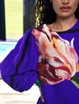 Chic blue dress with a tulip motif, embodying simplicity and elegance for both casual and dressy occasions.