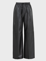 Black Track-Tic Pant shown on a model, illustrating its contemporary style and functionality for workouts and leisure.
