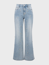 Light blue wide leg jeans arranged neatly, illustrating their spacious cut and classic denim appearance.