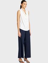 Tailored indigo suit pants on a hanger, highlighting their elegant cut and rich color suitable for business attire.