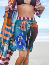 Brightly patterned Step Into Sunshine Shorts showcasing a multifish motif, perfect for warm weather and beach activities.