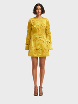 A mini dress featuring embellished bell sleeves, showcasing a luxurious design in a rich color.