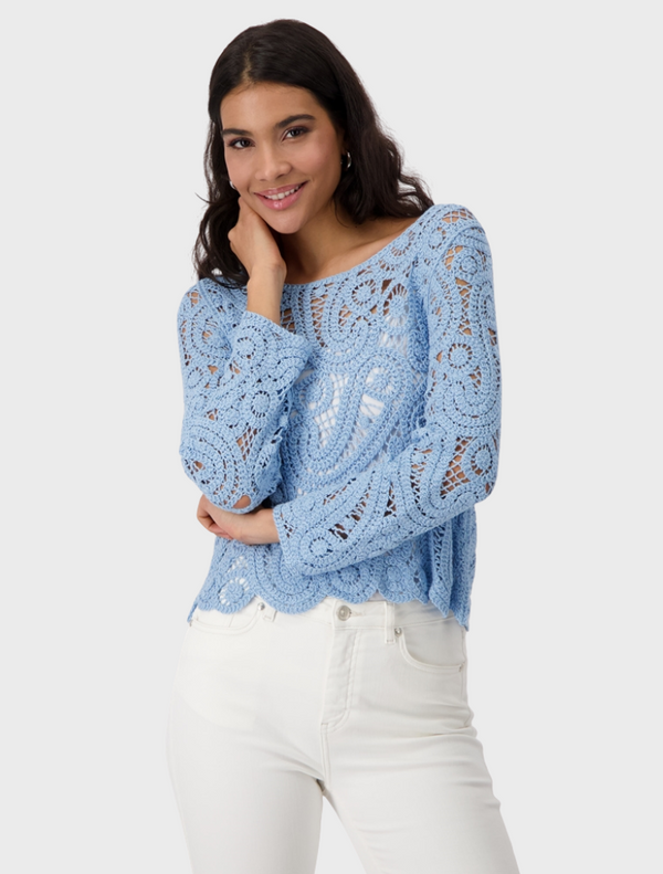 A stunning blue crochet sweater, highlighting its elegant texture and vibrant color.