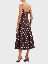 Chic Vivianne Strap Midi Dress showcasing a timeless polka dot pattern, suitable for various events and settings.

