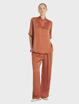 Copper-toned Swish Tux Plaza, presenting a chic and contemporary design with polished elements.