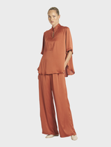Copper Swish Tux Plaza, featuring a contemporary aesthetic with smooth surfaces and refined detailing.