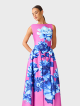 Sybella Midi Dress in pink and blue floral design, showcasing a boat neckline, cap sleeves, and a flowing fit-and-flare silhouette.