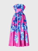 Elegant strapless maxi gown featuring a blue floral print on pink, with ruffles and detachable straps for versatile styling.