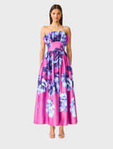 Strapless blue and pink floral maxi gown with ruffle detail, designed for elegant events and special occasions.
