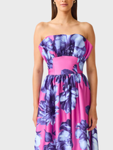 Timeless pink and blue floral maxi dress with ruffles, designed for weddings and formal events, featuring a secure strapless fit.