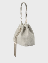 Sylvie Crystal Pouch: a small silver leather bucket bag featuring a tassel on the handle.