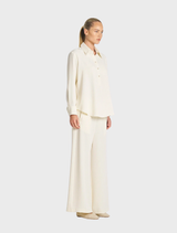 Elegant tab shirt in vanilla and black, perfect for both professional and casual wear.