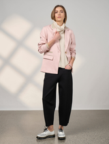 Blush tactical blazer featuring a tailored fit and functional pockets, ideal for both casual and professional settings.

