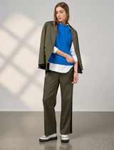 Khaki tactical pants displayed, featuring multiple pockets and a durable fabric suitable for outdoor activities.