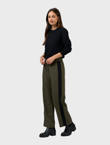 Khaki tactical pants featured, showcasing a robust design with ample pockets for functionality in various environments.