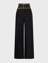 Silk-wool tailored pant with waist button detail, high-waisted design inspired by the elegance of matador costumes.