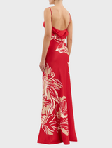 A bold red dress decorated with delicate gold and red floral motifs.