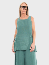 A green tank top displayed against a neutral background, showcasing its fabric texture and design.