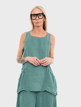 A vibrant green tank top laid flat, emphasizing its casual design and lightweight fabric.