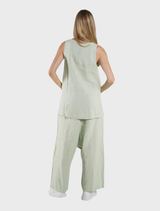 Lime tank top with a classic sleeveless cut, highlighted on a plain background for emphasis on its color.
