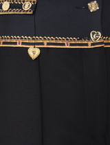 Elegant high-waisted tailored pant featuring waist button detail, crafted from silk-wool, inspired by matador costumes.